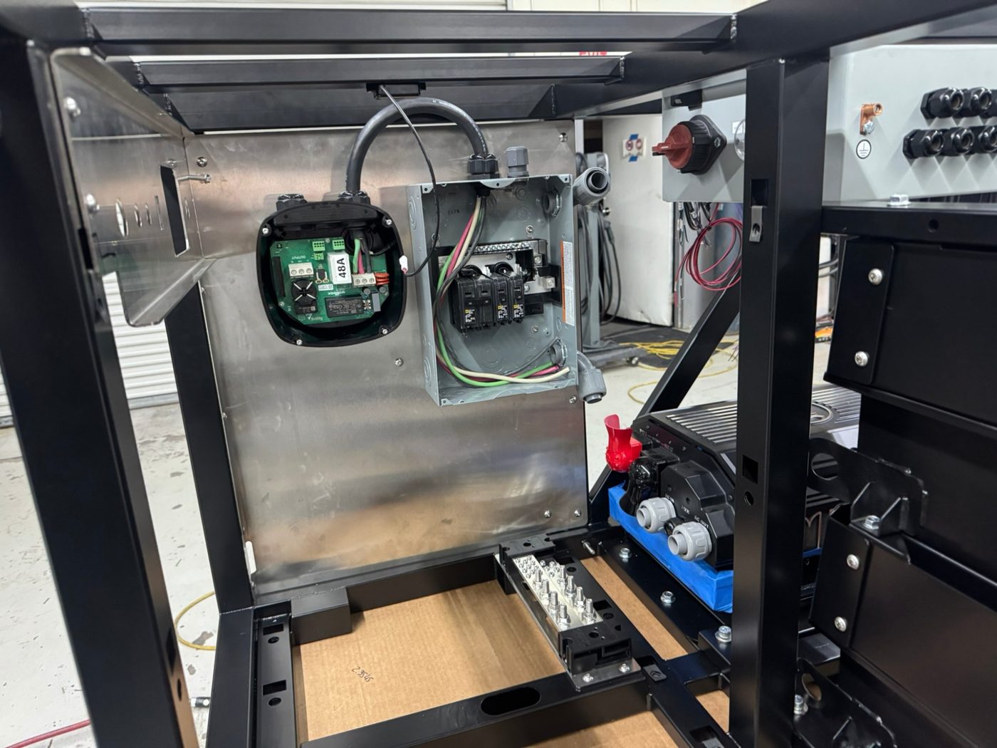 Level 2 EV charger and breaker panel wired into the TAP