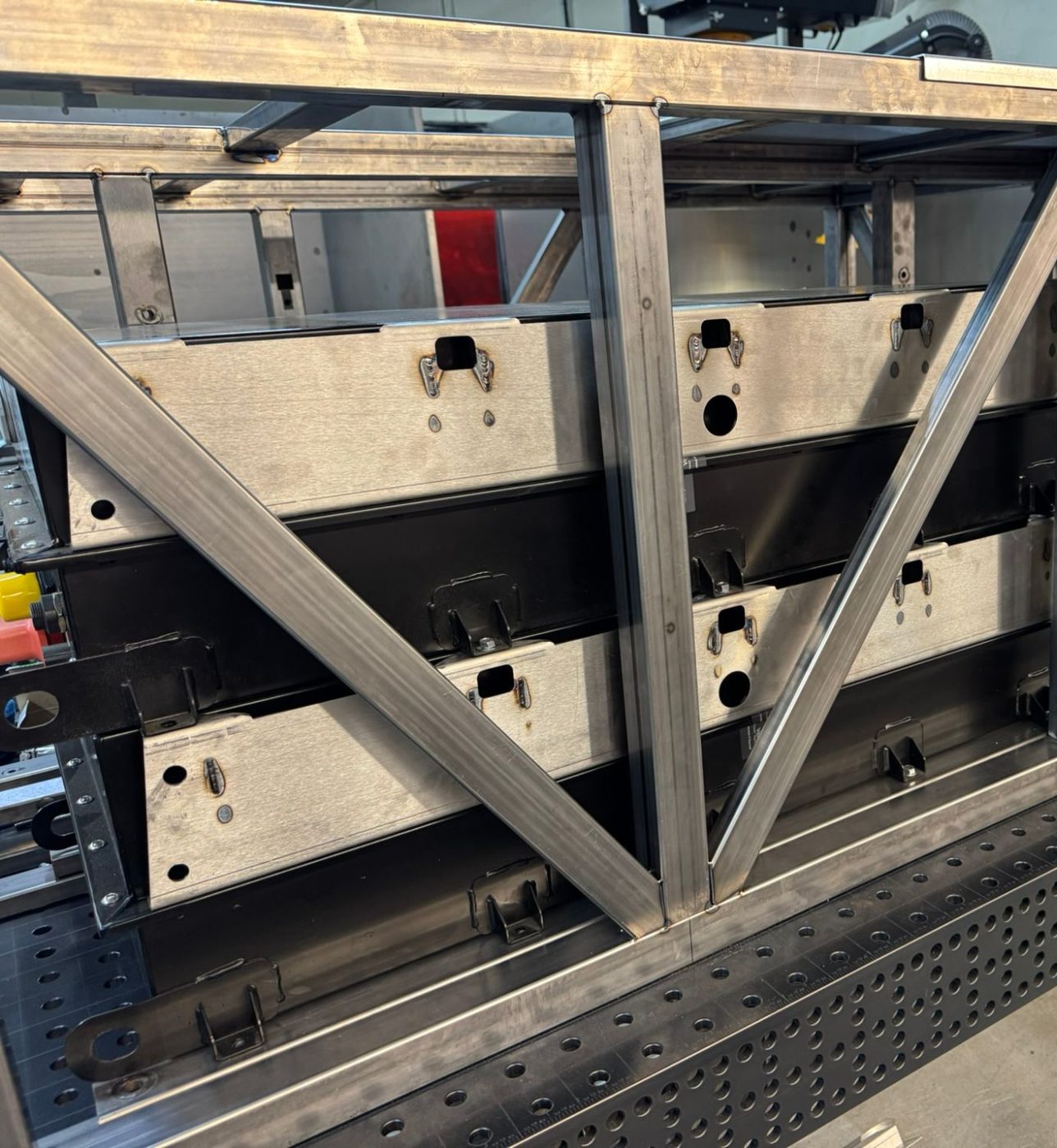 Welded steel chassis frame around the battery trays