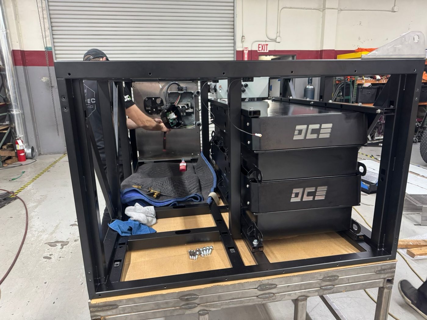 Battery modules going into the powder-coated TAP chassis