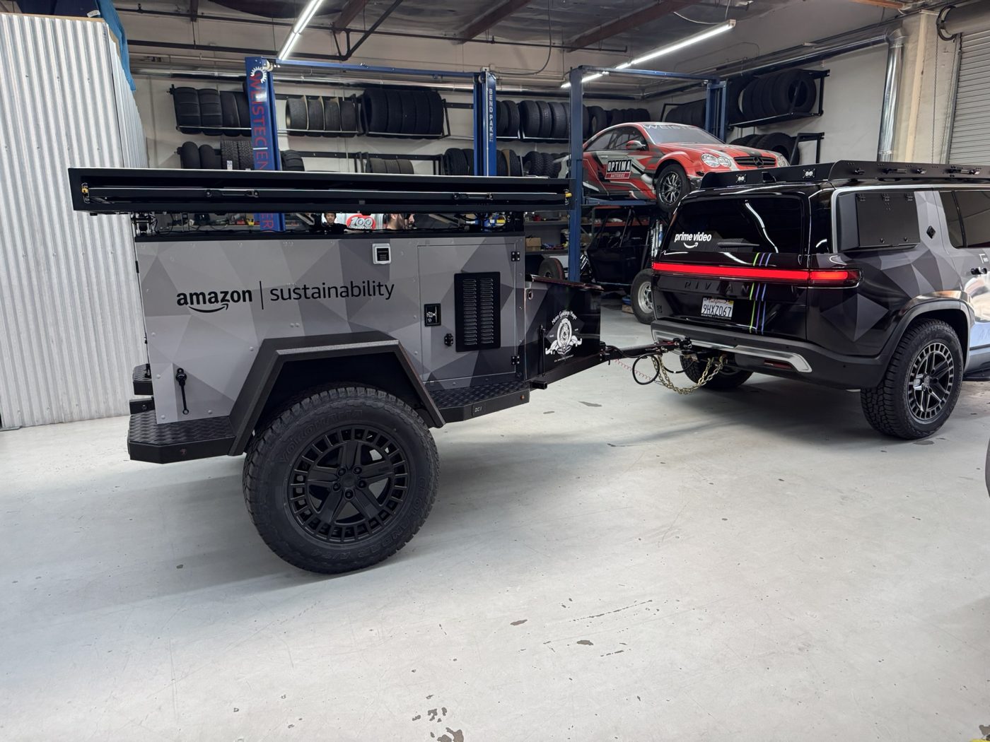 Finished TAP trailer hitched to the Rivian R1S in the shop