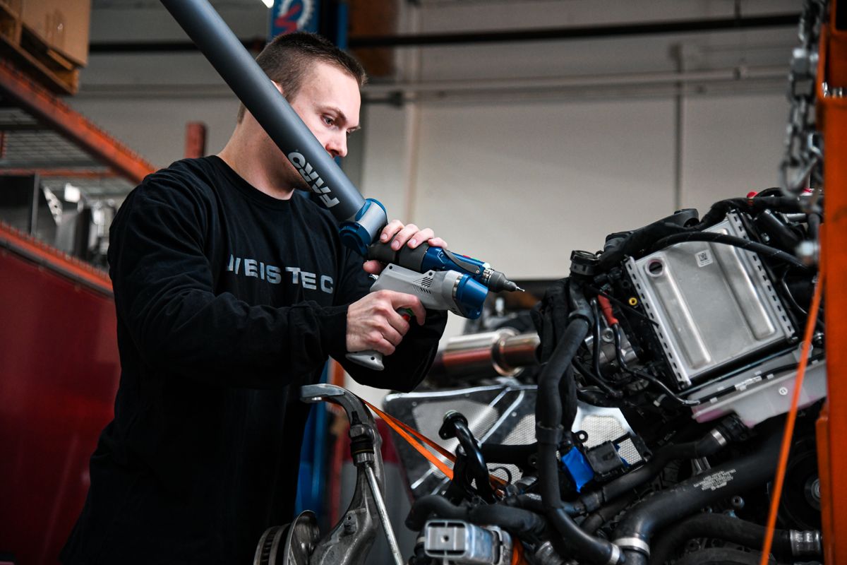 Technician measuring an assembly with a FARO arm