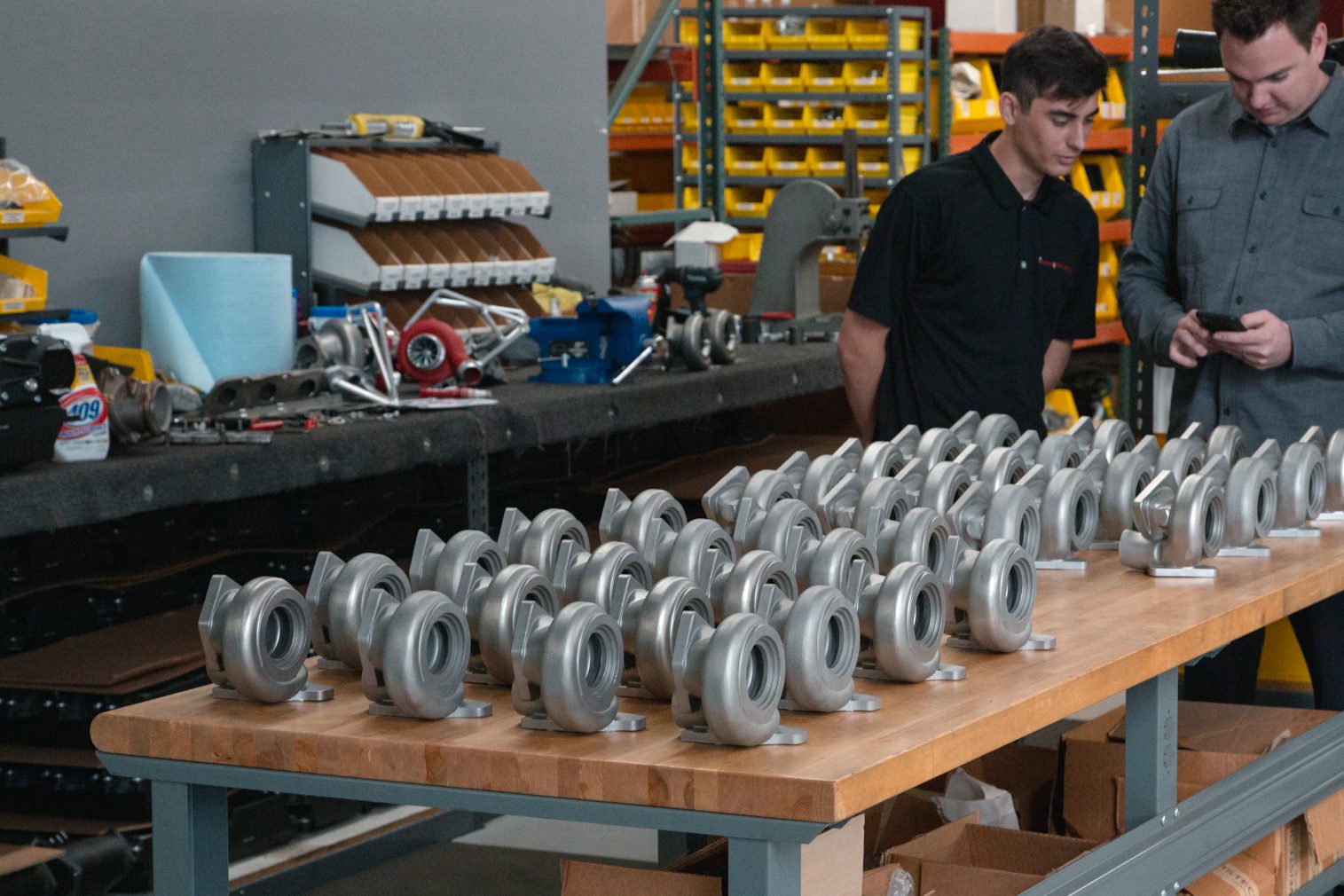 Weistec team inspecting a production run of turbine housings