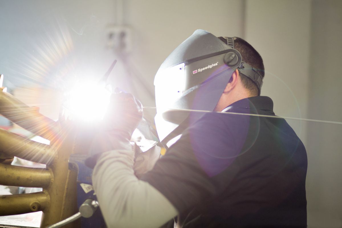 Welder performing TIG welding