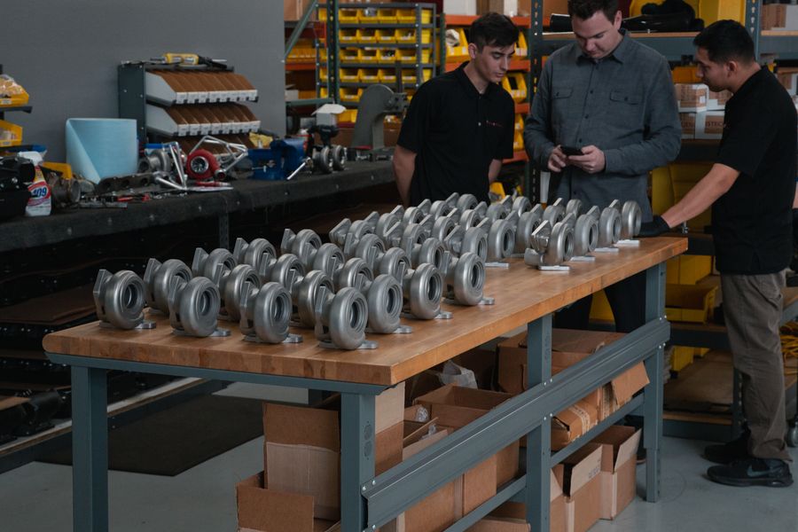 Team inspecting a batch of turbocharger housings